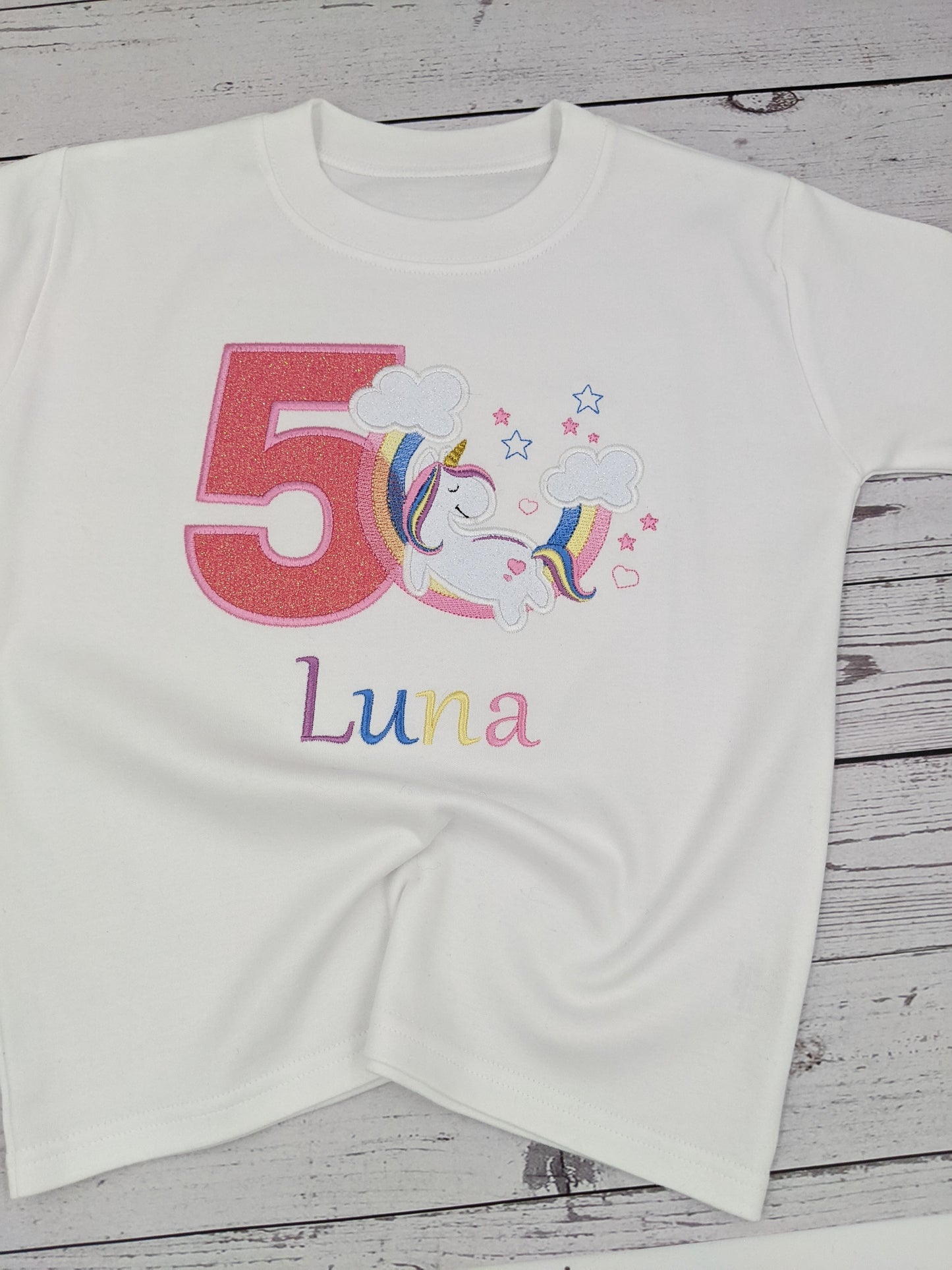 Children Personalised Birthday Tshirt with Unicorn Sleeping on a Rainbow - Embroidery